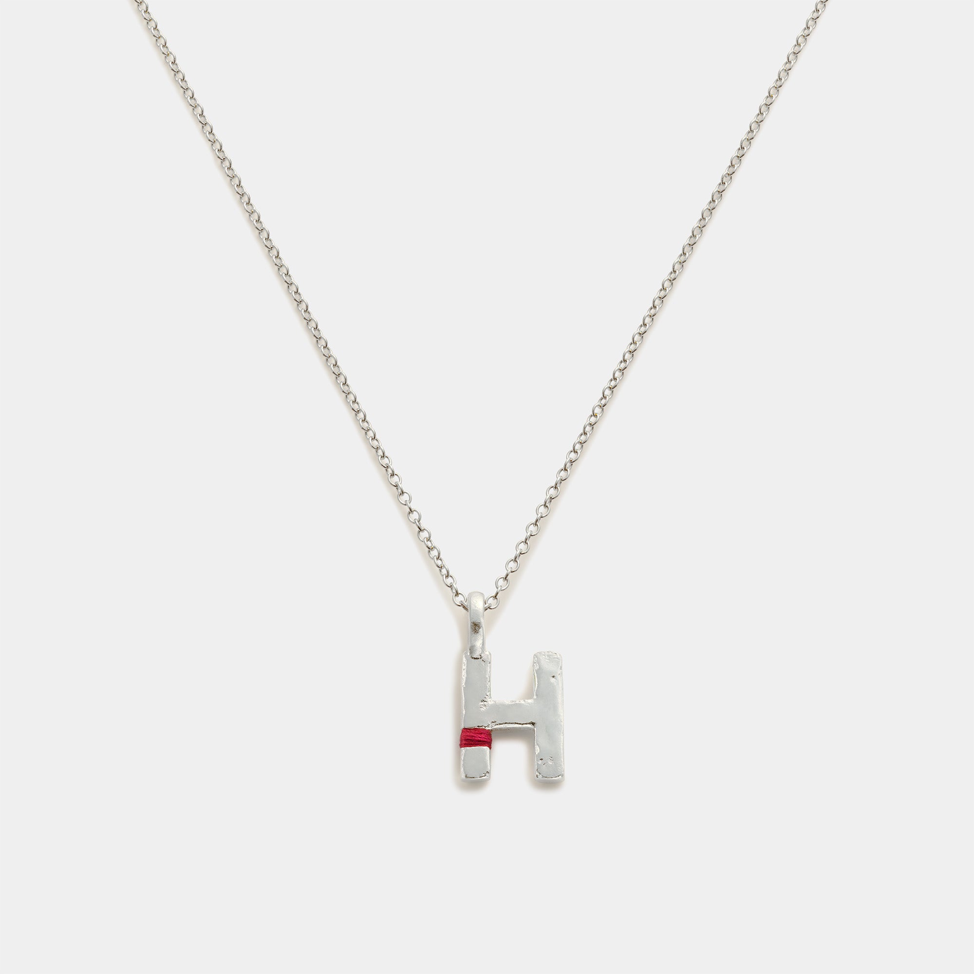 Silver necklace with a 'H' pendant