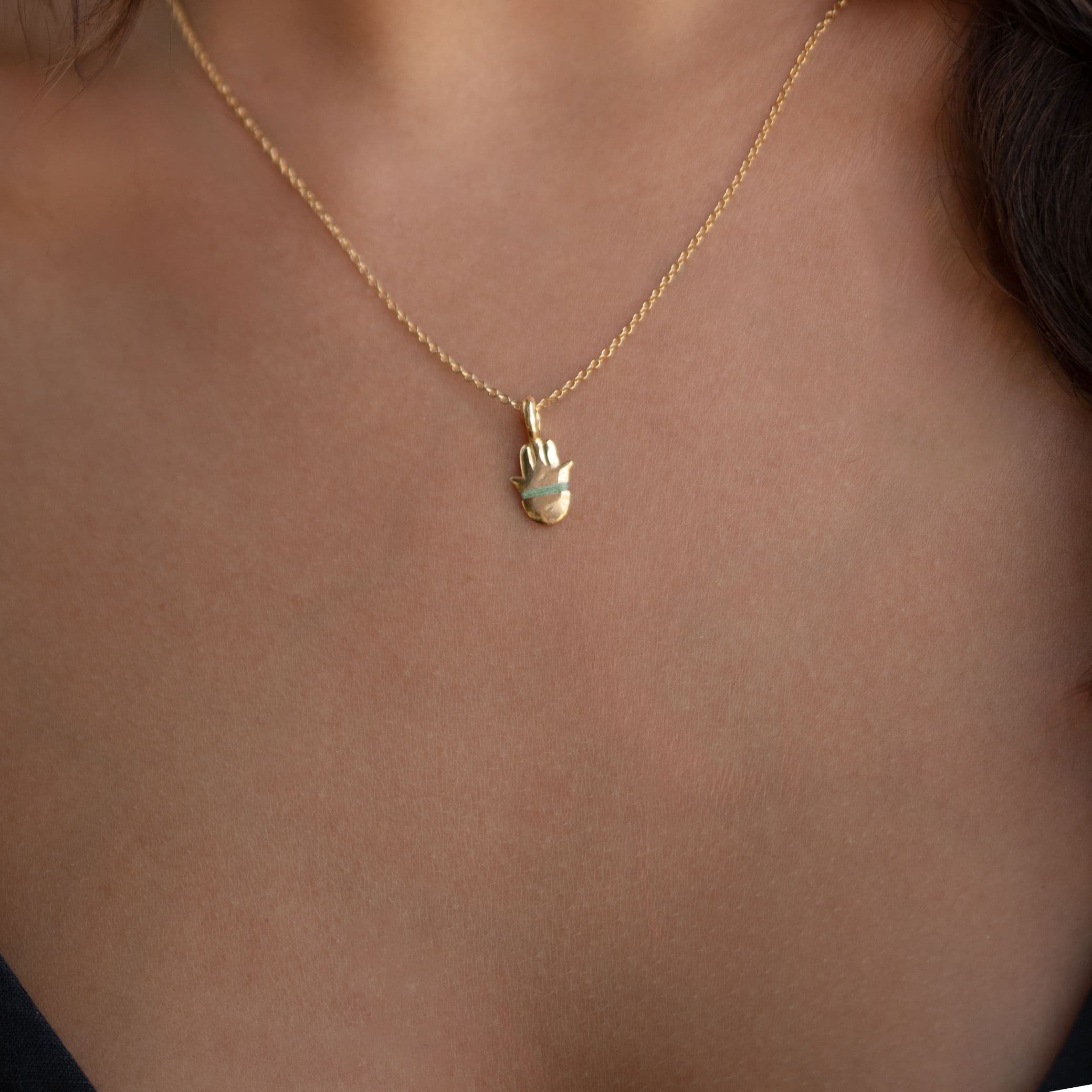 The Tiny Talisman Hamsa Necklace