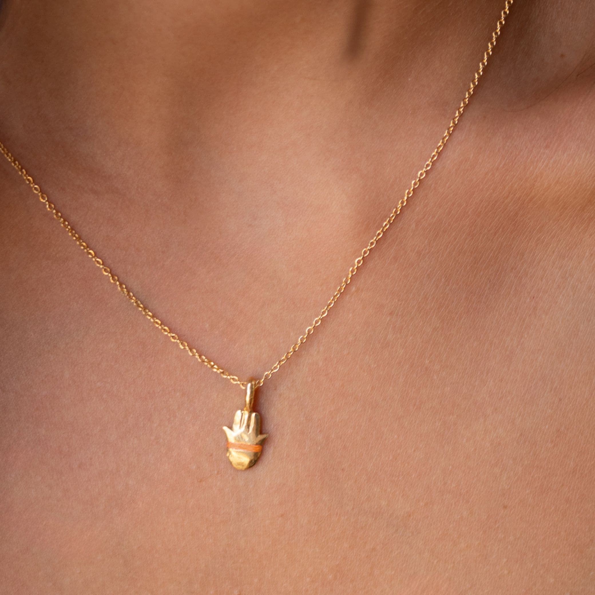 The Tiny Talisman Hamsa Necklace